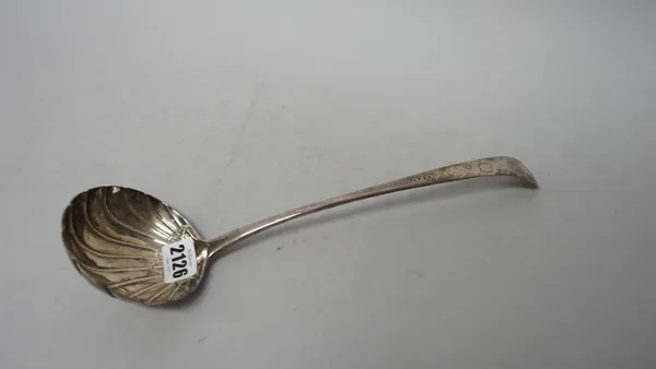 A George III Irish silver 18th century soup ladle, the bowl with partly fluted decoration, the handle with later floral decoration, Dublin 1772, weigh
