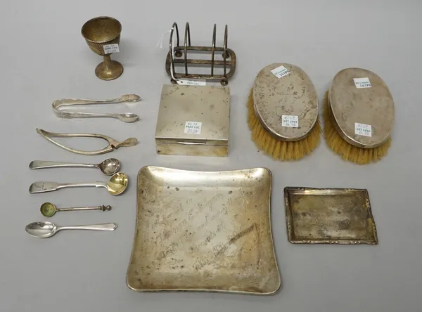 Silver and silver mounted wares, comprising; a pair of oval hairbrushes, Birmingham 1921, a square cigarette box, wooden lined within, London 1922, an