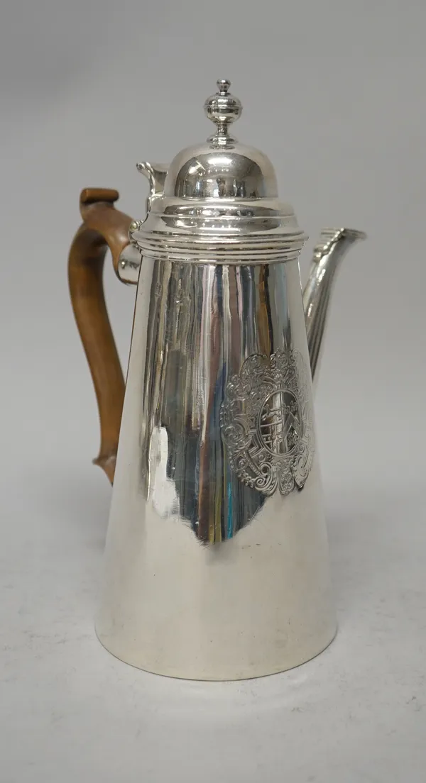 A Britannia Standard silver coffee pot, of tapered cylindrical form, the hinged lid with a turned finial and a scroll thumbpiece, the spout with a hin