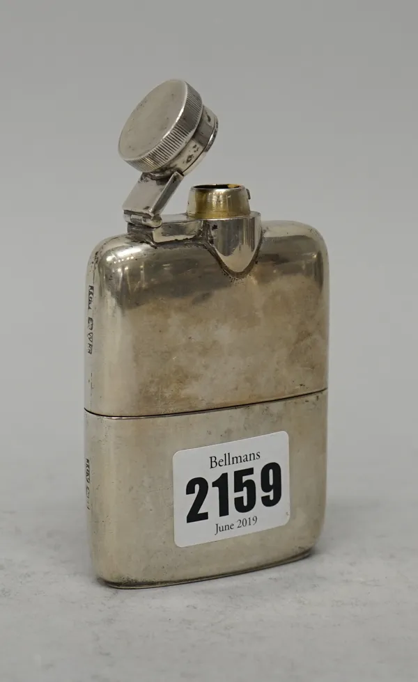 A silver curved rectangular spirit flask, with a milled screw-down cap and with a pull-off beaker base, Chester 1923, length 9.2cm, gross weight  120