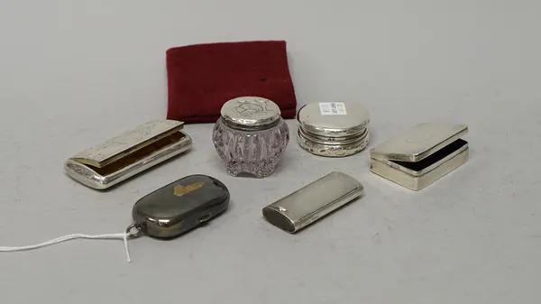 Silver and silver mounted wares, comprising; a rectangular hinge lidded matchbox, with engine turned decoration, Chester 1913, a slide action vesta bo