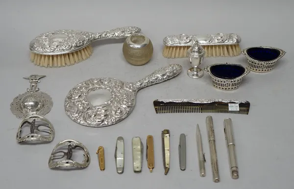 A lady's silver mounted four piece dressing set, comprising; a hairbrush, a hand mirror, a clothes brush and a comb, a silver pepperette, a pair of si