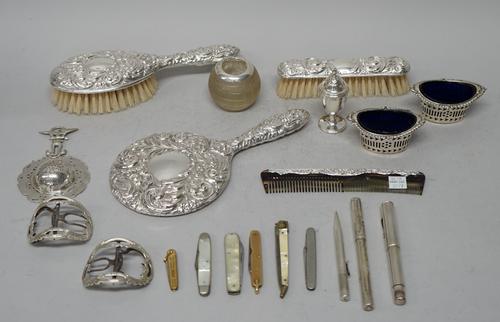 A lady's silver mounted four piece dressing set, comprising; a hairbrush, a hand mirror, a clothes brush and a comb, a silver pepperette, a pair of si