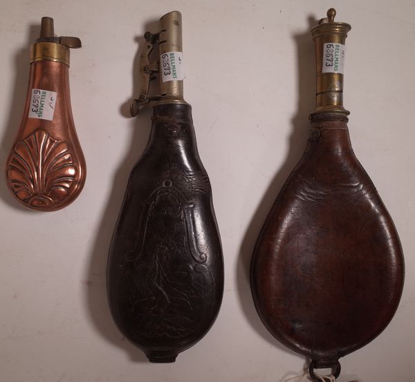 A group of three 19th century French shot flasks, the largest with embossed leather 23cm long, the smallest with shell motif, 13cm long, (3).