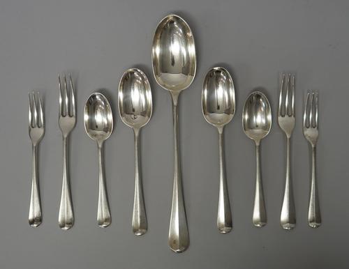 A silver rat tail pattern part table service, comprising; one stuffing spoon, five tablespoons, fifteen dessert spoons, twenty-two dessert forks and e