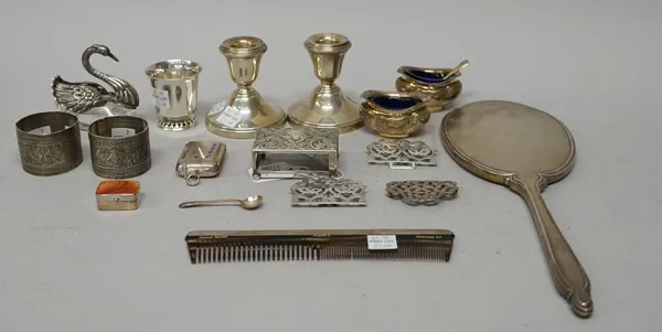 Silver and silver mounted wares, comprising; a pair of small candlesticks (loaded) Birmingham 1969, a glass salt modelled as a swan, a hand mirror, a