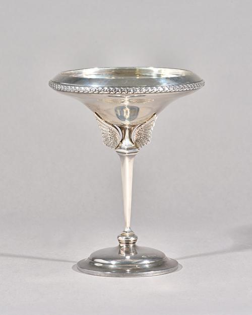 A George VI silver trophy cup, replicating The Senior's Championship Cup St Andrews, the tapered stem with cast bird wings, on a circular domed base,