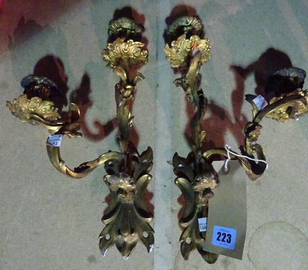 A pair of Regency acanthus moulded twin brass brass candelabra, 35cm high.