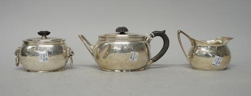 Tiffany And Co., New York; a late 19th century American silver three piece tea set, each decorated with bands of engraved strapwork, marked 1688, 925/