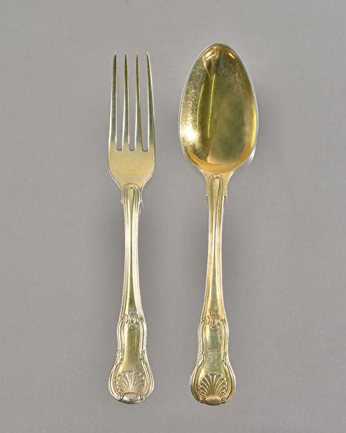 A George IV silver gilt part flatware service in the hourglass pattern, Eley, Fearn and Chawner, London 1829, comprising; 12 table spoons and 10 table