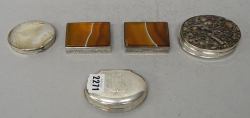 A white metal and parcel-gilt shaped box, probably 18th Century, marked PW, the cover with a battle scene, 9cms wide; a pair of Continental white meta