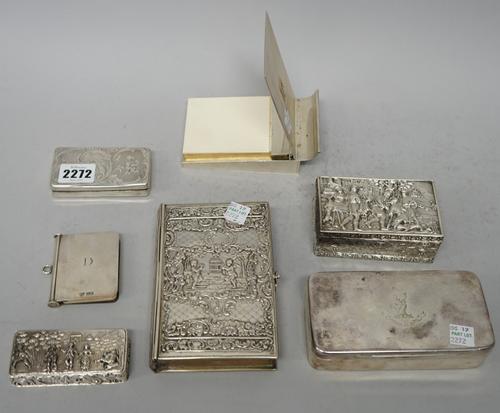 A 19th century French rectangular box, engraved with foliage, 8.5cms wide; two rectangular silver boxes, each with a scene with figures in a town (one
