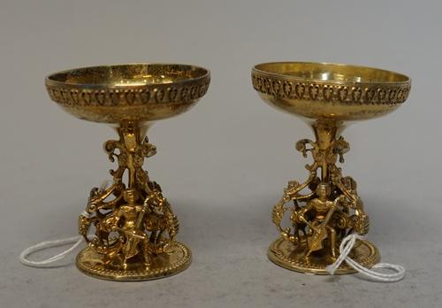 A pair of Victorian Scottish silver gilt ornaments, William Marshall Edinburgh, no date mark, each with bowl on pierced stand with three cellists belo