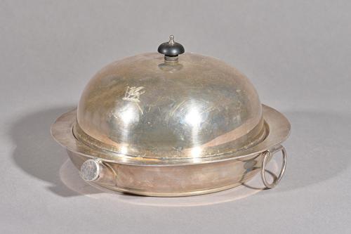 An early 20th century silver muffin dish with Argyle warmer base of good gauge, Charles Boyton & Sons, London 1922, turned finial above crest engraved