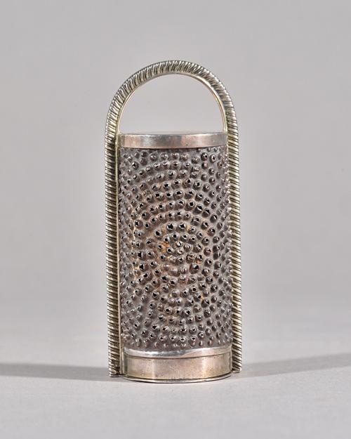 A George III silver nutmeg grater, Thomas & James Phipps, London 1817, steel rasp within gadroon frame, hinged base, 10.5cms high, 84g. gross. Illustr