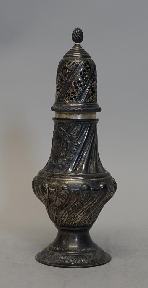 A late Victorian silver sugar caster, with embossed fluted decoration, the pull-off top with pierced decoration and flame finial, presentation engrave