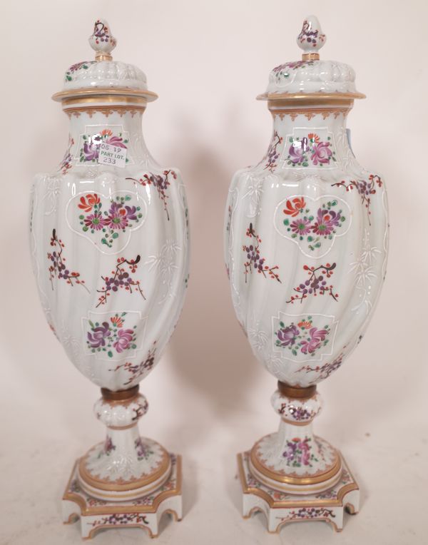 A pair of Samson porcelain vases and covers 37cm high, (a.f.).