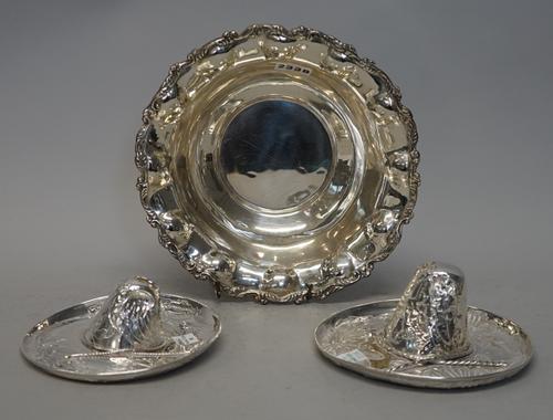 A Mexican silver bowl, of shaped circular form, with a cast scroll rim, detailed Mexico 925 and two Sterling silver sombreros, detailed 925, combined
