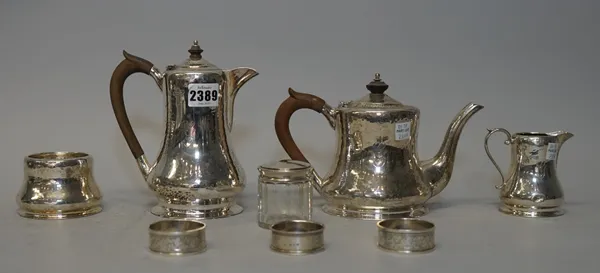 A George V silver four piece tea set, comprising; a teapot, a hot water jug, a sugar bowl and a milk jug, each piece of pear shaped form and with plan