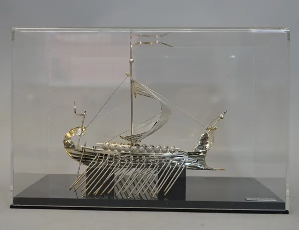 A model of a sailing galley, the label within the case detailed M.D.R. Collection, Handmade 925, displayed in a perspex box.