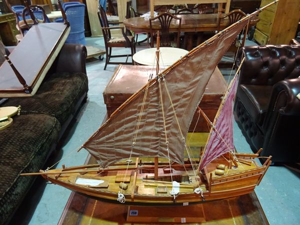 A scale model of a wooden Dow 'sambuck', 85cm wide x 77cm high.