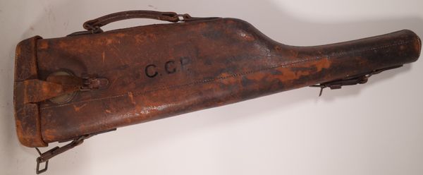 An early 20th century brown leather leg of mutton gun case, 79cm long.