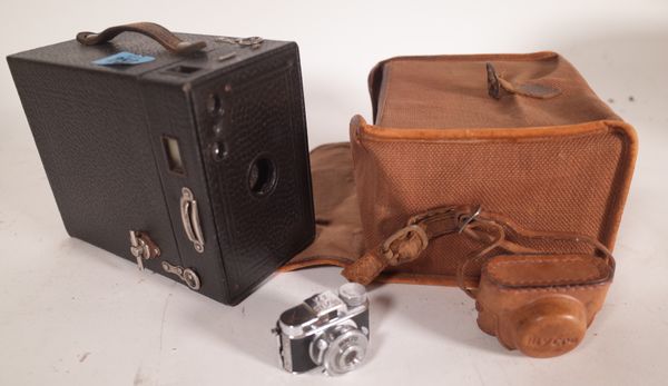 A Kodak Brownie camera and a miniature micro camera, (2).