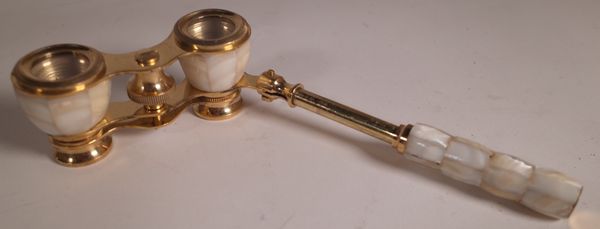 A pair of gilt brass and mother of pearl folding opera glasses.