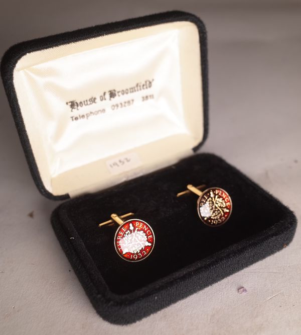 A pair of gold plated and enamel 1932 three piece cufflinks.