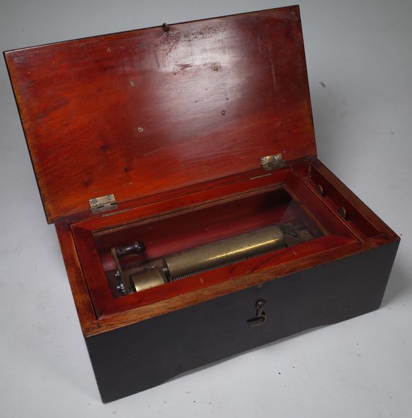 A small cylinder music box, late 19th century, with 4.5 inch cylinder in an ebonised mahogany case, 29.2cm wide.