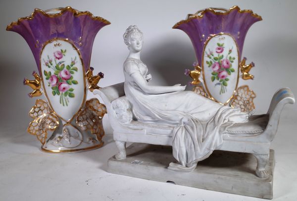 A pair of Victorian floral decorated vases 34cm high and a Continental bisque porcelain figure of a reclining lady, (3).