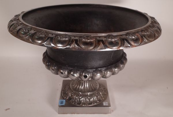 A 20th century cast iron urn with egg and dart decoration on plinth base, 56cm wide x 34cm high.