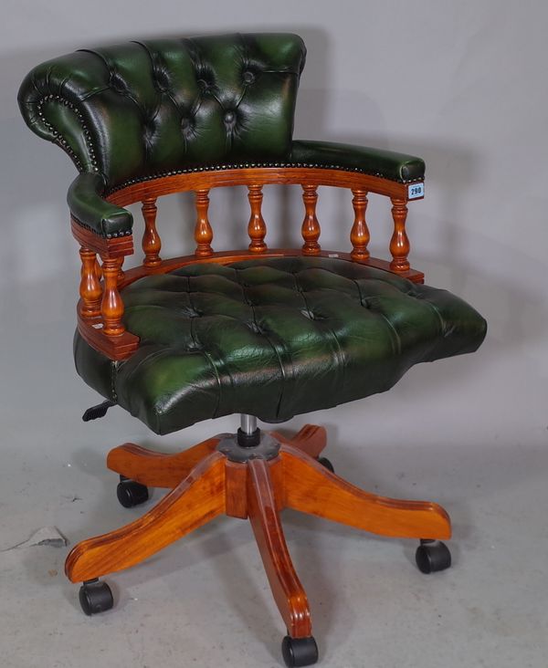 A 20th century green leather upholstered tub back office swivel chair on a five point base, 60cm wide x 87cm high.