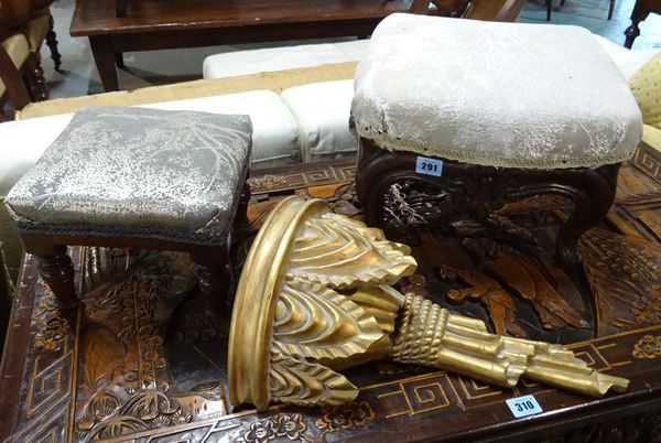 A Victorian oak framed shaped foot stool, 36cm wide x 23cm high, together with another foot stool and a gilt wall bracket.