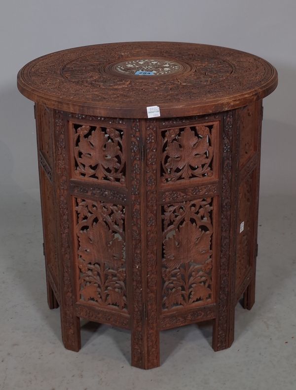 A 20th century North African bone inlaid sandlewood occasional table on folding base, 47cm diameter x 47cm high.