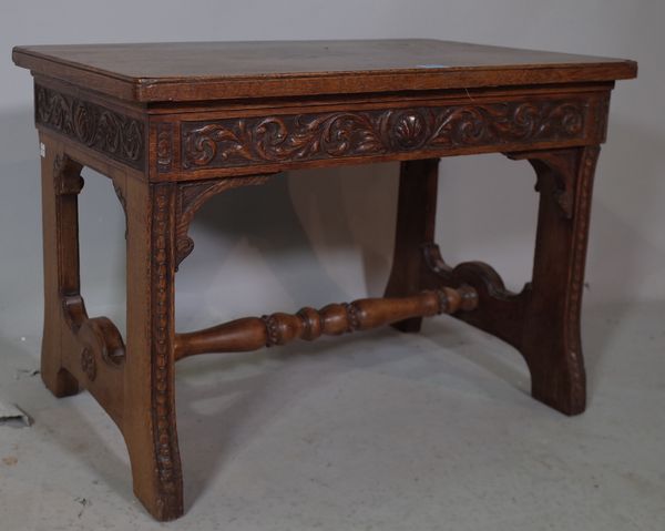 A 19th century oak occasional table/bench on trestle supports united by turned stretcher, 68cm wide x 48cm high.