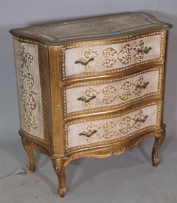 An Italian parcel gilt and gold painted serpentine chest of three drawers, 78cm wide x 80cm high.