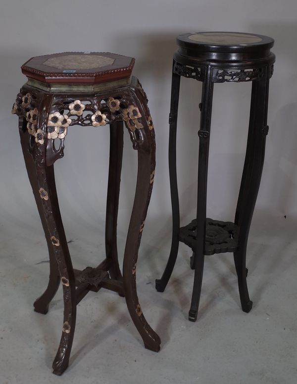 A 20th century Chinese hardwood octagonal jardinaire stand with inset marble top, 38cm wide x 94cm high and one other similar, 30cm wide x 96cm high.