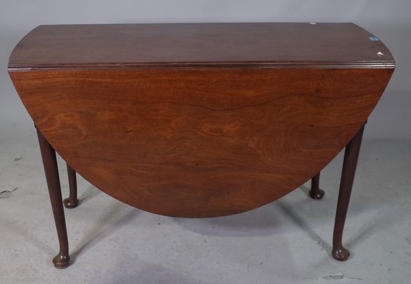 A mid-18th century mahogany oval drop flap table on pad feet, 115cm wide x 71cm high.