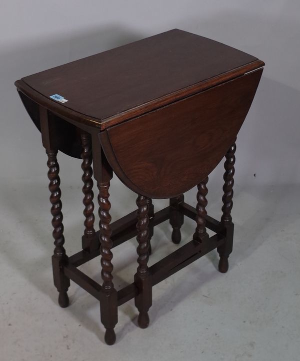 A mid-20th century oak drop flap table on barley-twist supports, 61cm wide x 72cm high.