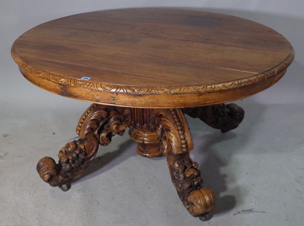 A 19th century Continental oak oval centre table, on four carved downswept supports, 130cm wide x 68cm high.   43