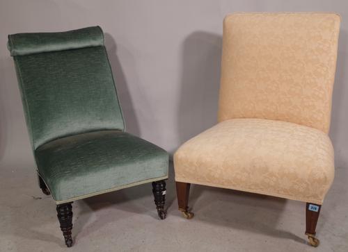 An early 20th century mahogany framed low chair and another similar, (2).