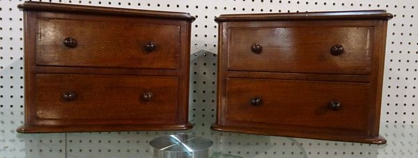 A pair of Victorian mahogany two drawer miniature chests, 30cm wide x 20cm high.