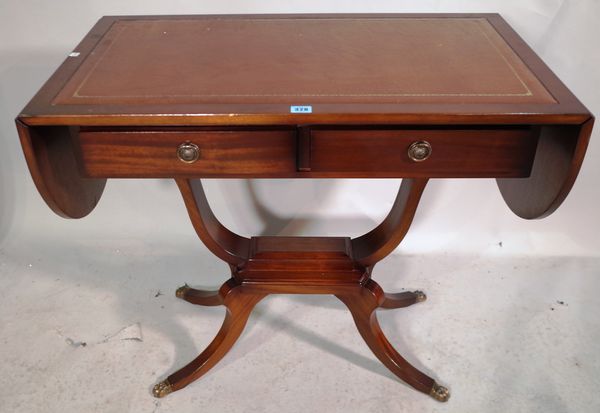 A George III style mahogany sofa table with two drawers and tan leather inset top, 88cm wide x 75cm high.