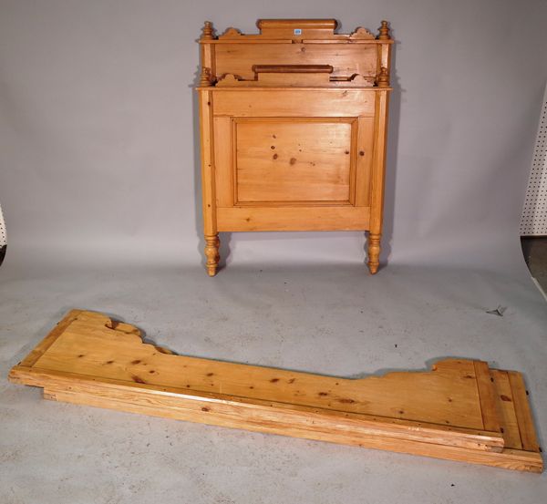 An early 20th century pine single sleigh bed, 90cm wide x 125cm high.