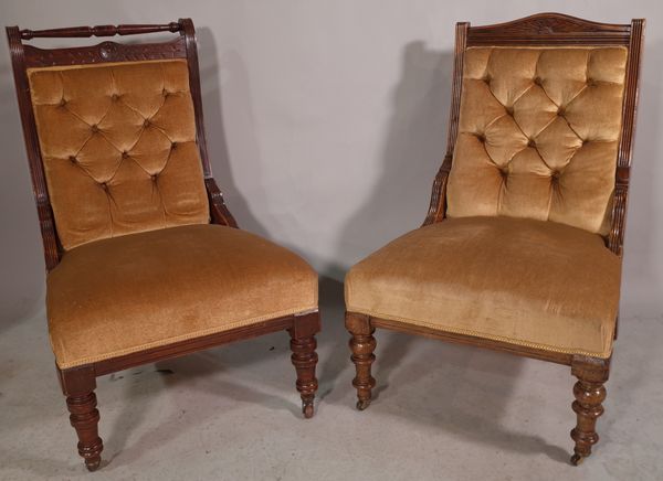 A late Victorian mahogany low armchair and another similar, (2).