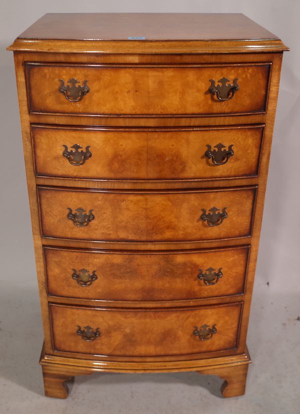 A George III style walnut chest of five graduated drawers on bracket feet, 53cm wide x 94cm high.