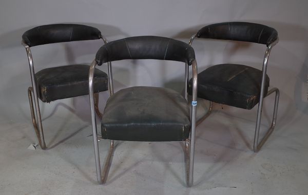 "Stell, 3 Duke Street Adelphi London", a set of three black leather upholstered tub back chairs, on tubular chrome supports, 55cm wide x 78cm high.