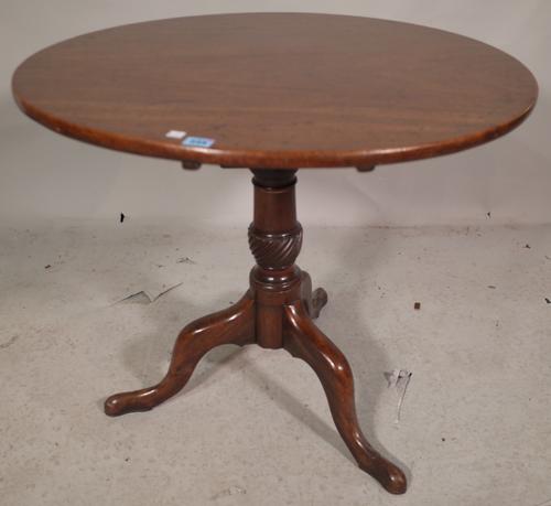 A George III mahogany tripod table, the birdcage mount over three downswept supports, 78cm wide x 70cm high.