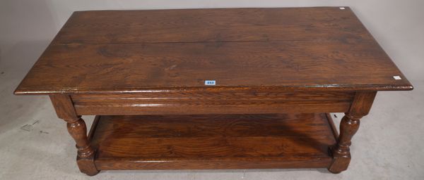 A 20th century oak rectangular coffee table with undertier 122cm wide x 48cm high.